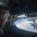 A KC-135 Stratotanker refuels F-15