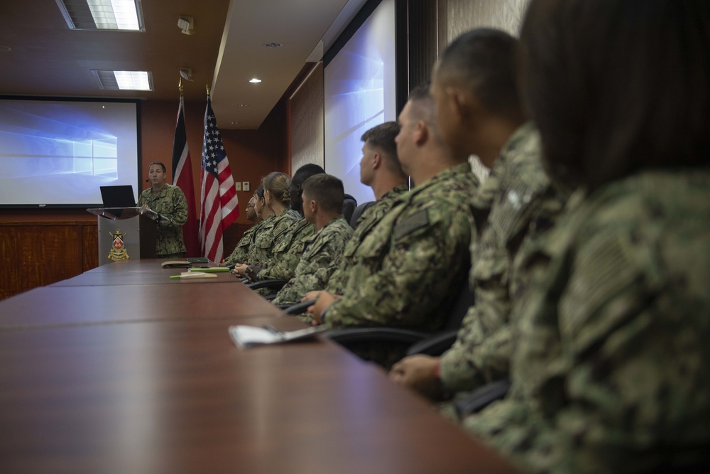 Capt. Brian J. Diebold, commodore of Destroyer Squadron (DESRON) 40, address U.S. Navy Sailors and Trinidad and Tobago military professionals during a brief