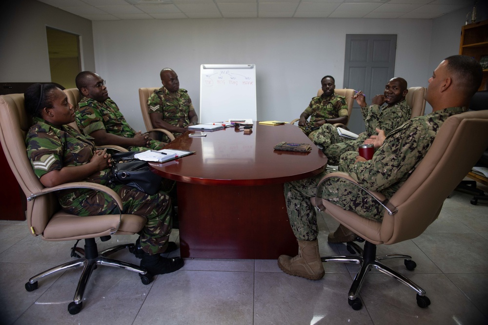 Lt. David Cruz, from San Diego, Calif., speaks with Trinidad and Tobago (TTO) military religious professionals at the TTO Defence Force headquarters