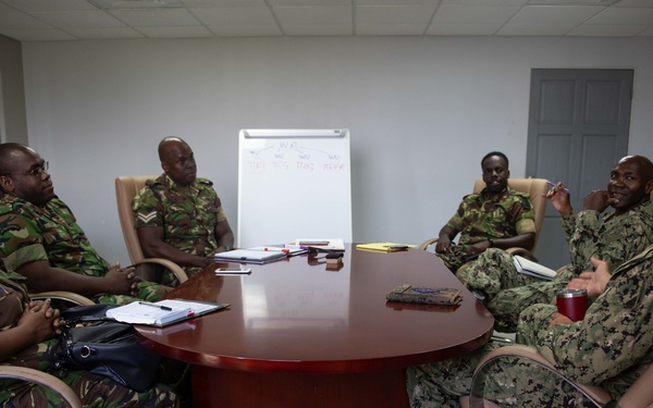 Lt. David Cruz, from San Diego, Calif., speaks with Trinidad and Tobago (TTO) military religious professionals at the TTO Defence Force headquarters
