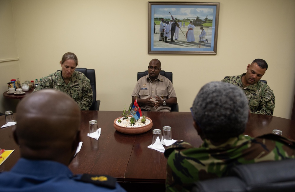 Cmdr. Israel Dowlat, force surgeon of the Trinidad and Tobago center, speaks with U.S. Navy Sailors and Trinidad and Tobago (TTO) military professionals