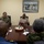 Cmdr. Israel Dowlat, force surgeon of the Trinidad and Tobago center, speaks with U.S. Navy Sailors and Trinidad and Tobago (TTO) military professionals