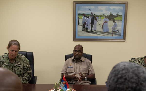 Cmdr. Israel Dowlat, force surgeon of the Trinidad and Tobago center, speaks with U.S. Navy Sailors and Trinidad and Tobago (TTO) military professionals