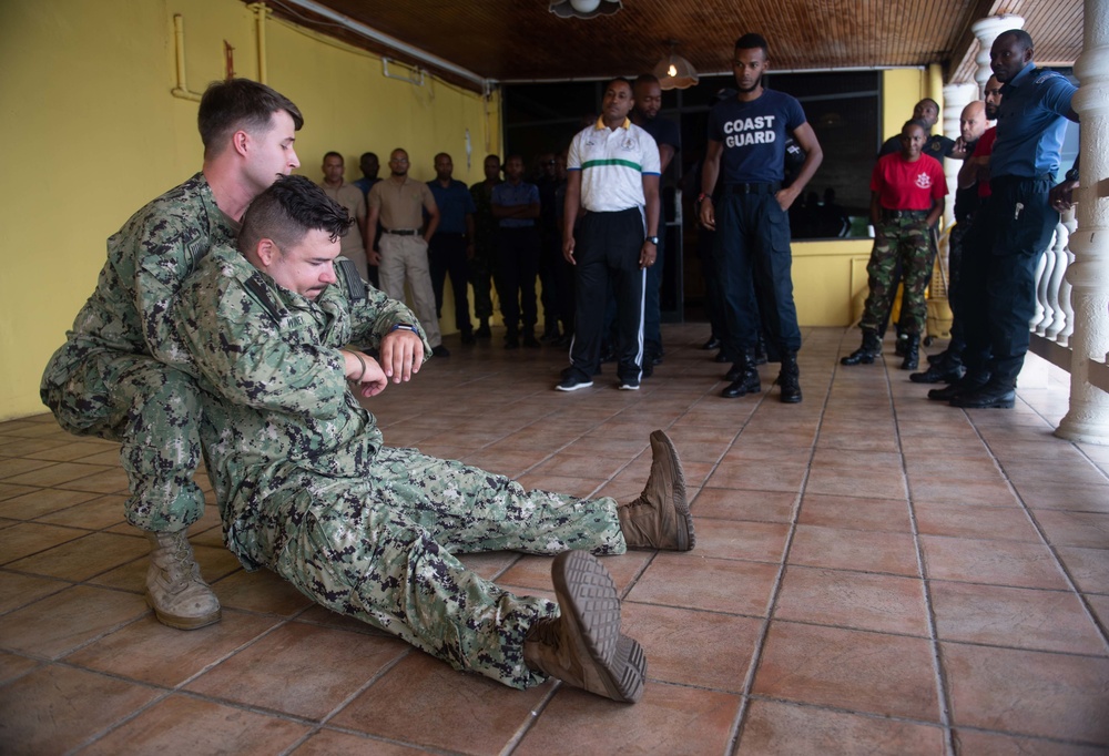 Hospital Corpsman 3rd Class Austin Jensen, from Seaboard, N.C., performs a one-person drag as part of a subject matter expert exchange with Trinidad and Tobago (TTO) military professionals