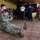 Hospital Corpsman 3rd Class Austin Jensen, from Seaboard, N.C., performs a one-person drag as part of a subject matter expert exchange with Trinidad and Tobago (TTO) military professionals