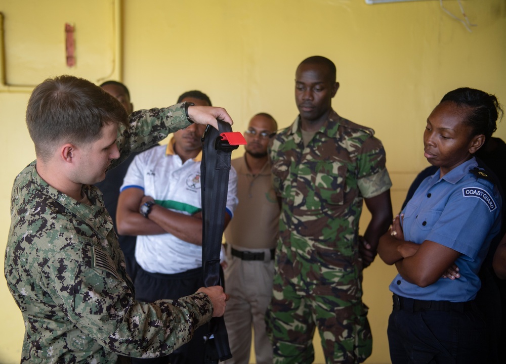 Hospital Corpsman 3rd Class Austin Jensen, from Seaboard, N.C., pulls on a dragline as part of a subject matter expert exchange with Trinidad and Tobago (TTO) military professionals