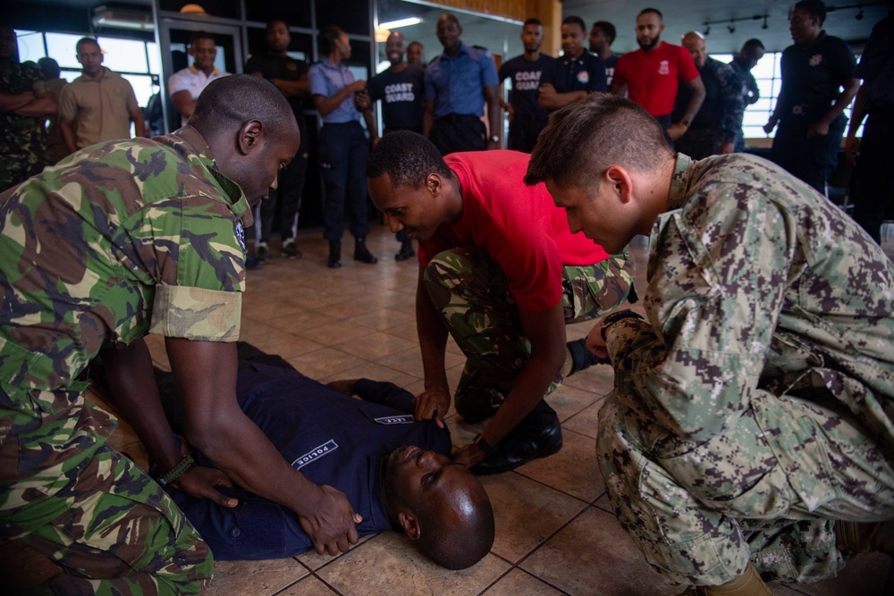 Hospital Corpsman 3rd Class Bishop Sisemore, (right) from Summers, A.R., participates in a subject matter expert exchange with Trinidad and Tobago (TTO) military professionals