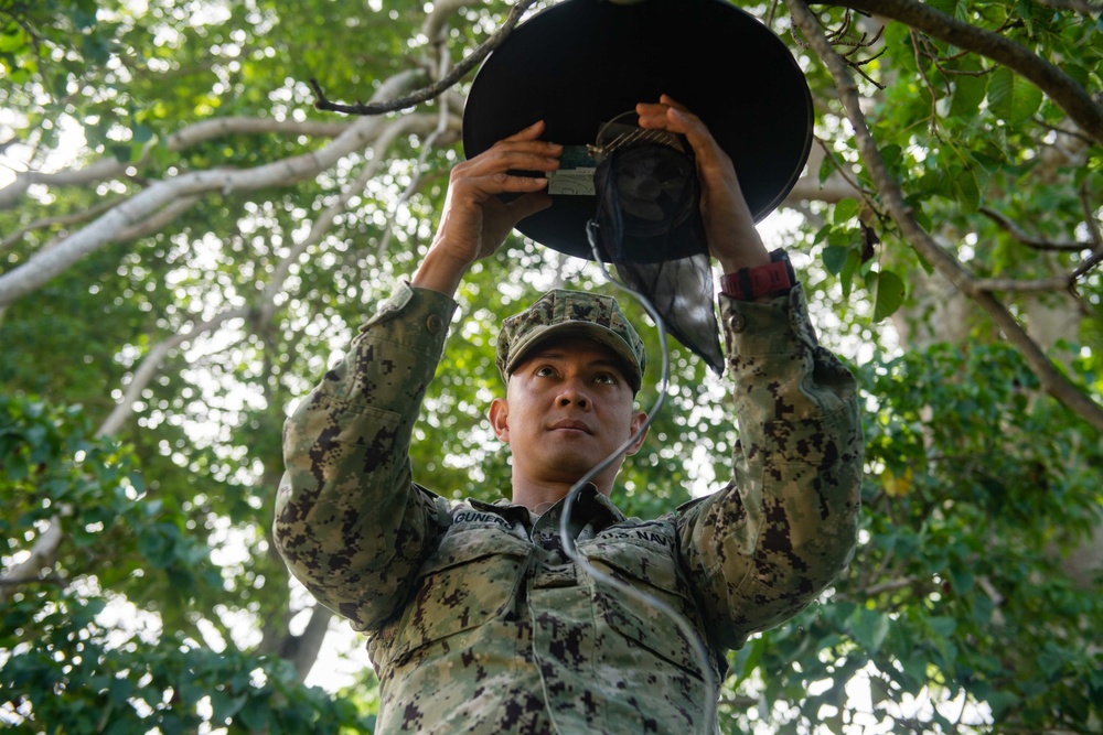 Hospital Corpsman 2nd Class Roderick Lagunero, from San Diego, Calif., assembles a mosquito trap at the Trinidad and Tobago Coast Guard base during Southern Partnership Station 2018