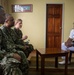 U.S. Navy Sailors meet with a Trinidad and Tobago (TTO) military professional at the TTO Coast Guard base as part of a subject matter exchange