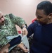 Hospital Corpsman 3rd Class Christian Winey, from Ludington, M.I., applies an arm splint as part of a subject matter expert exchange with Trinidad and Tobago (TTO) military professionals