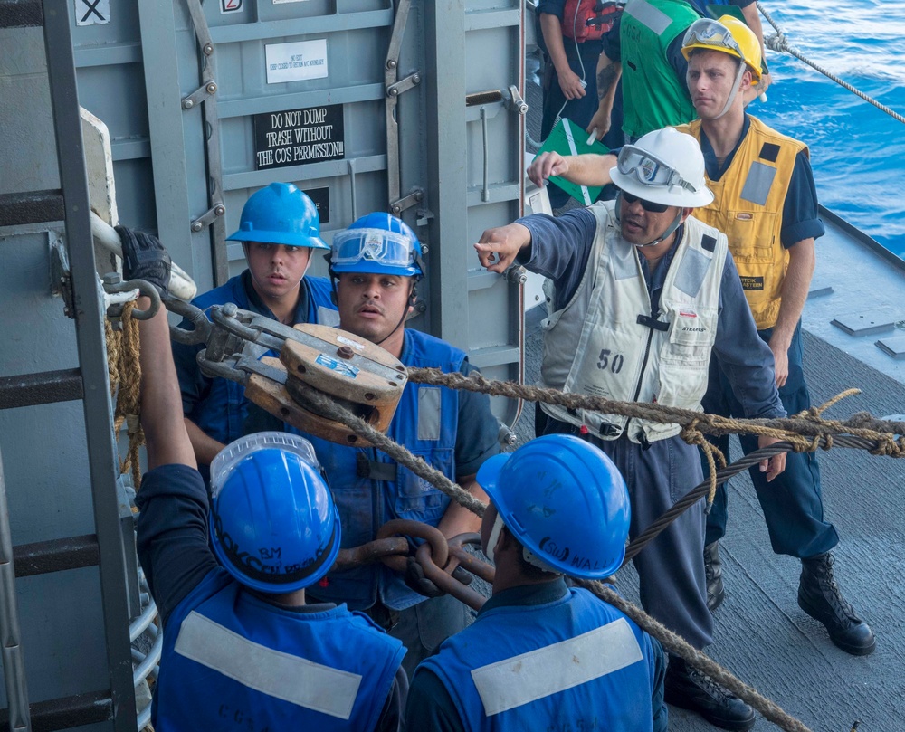 USS Antietam (CG 54) Sailors secure a line during an underway replenishment with USNS Tippecanoe (T-AO-199)