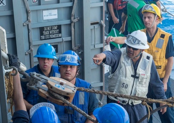 USS Antietam (CG 54) Sailors secure a line during an underway replenishment with USNS Tippecanoe (T-AO-199)