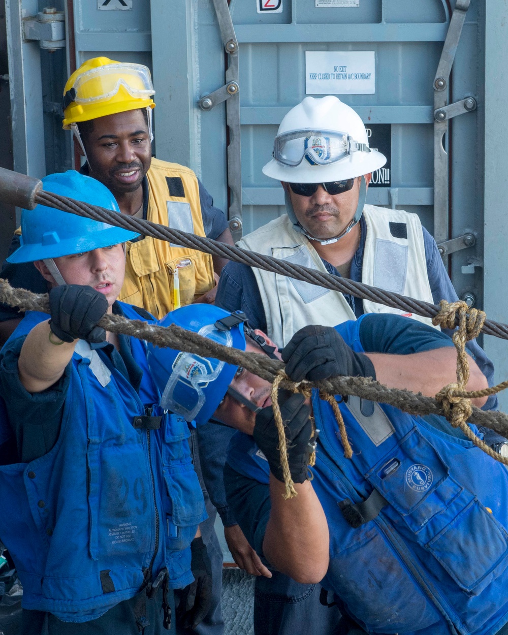 USS Antietam (CG 54) Sailors secure a line during an underway replenishment with USNS Tippecanoe (T-AO-199)