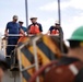 A Coast Guard Cutter Fir Chief Boatswain Mate describes their process to members of the Panama Port Authority