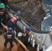 Coast Guard Cutter Fir crewmembers observe the marine growth on a whistle buoy in Panama