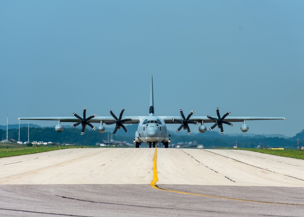 A C-130 Hercules taxis onto the runway at Volk Field Air National Guard Base