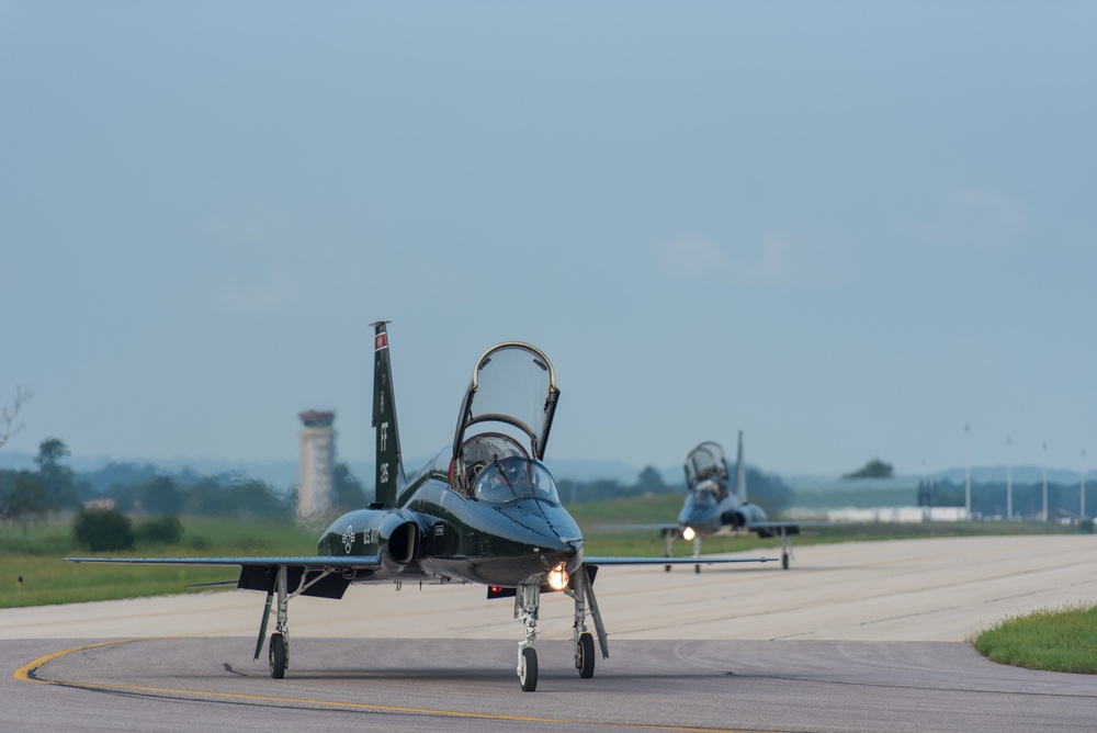 T-38 Talons taxi to the runway at Volk Field Air National Guard Base