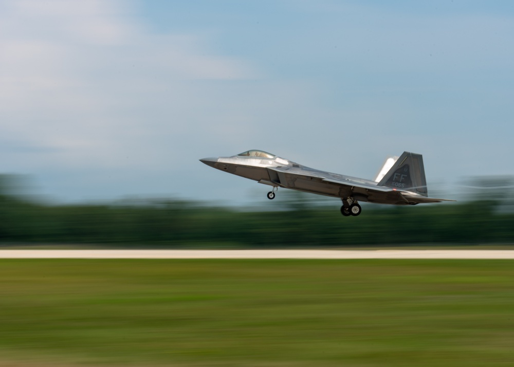 An F-22 Raptor lands at Volk Field Air National Guard Base during Northern Lightning