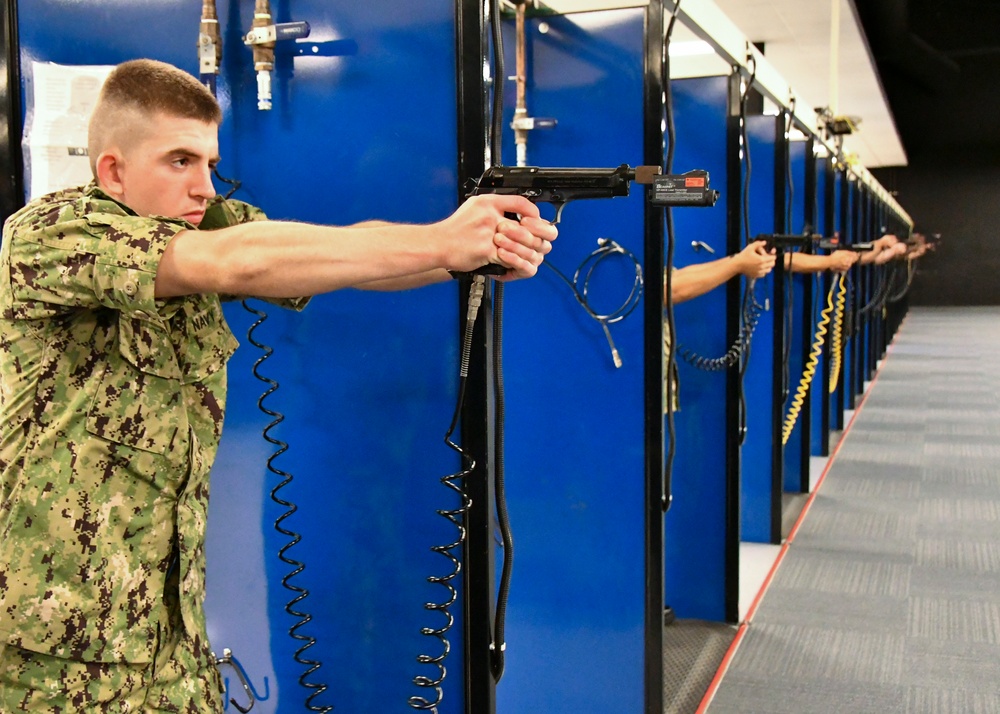 Recruits train at the Small Arms Marksman Trainer at Recruit Training Command