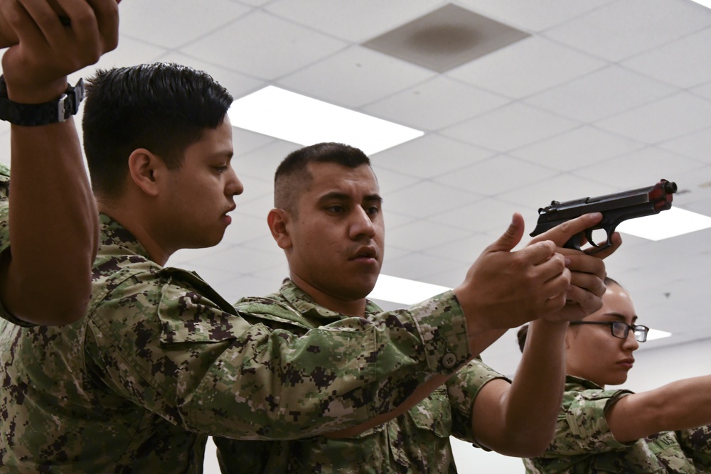 Recruits train at the Small Arms Marksman Trainer at Recruit Training Command