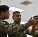 Recruits train at the Small Arms Marksman Trainer at Recruit Training Command