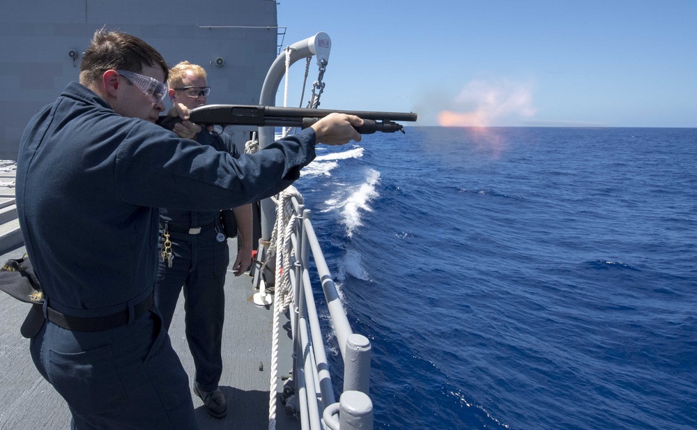 USS Antietam (CG 54) Sailor fires a shotgun during a live-fire weapon training exercise