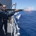 USS Antietam (CG 54) Sailor fires a shotgun during a live-fire weapon training exercise