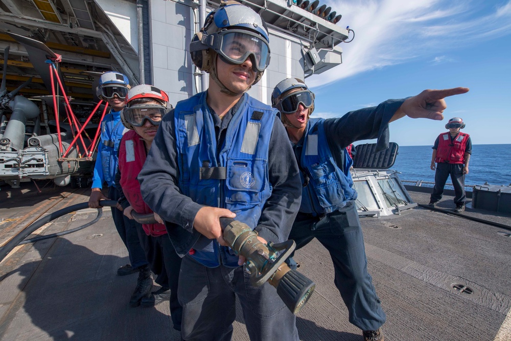 USS Antietam (CG 54) Sailors engage in a crash and salvage training drill