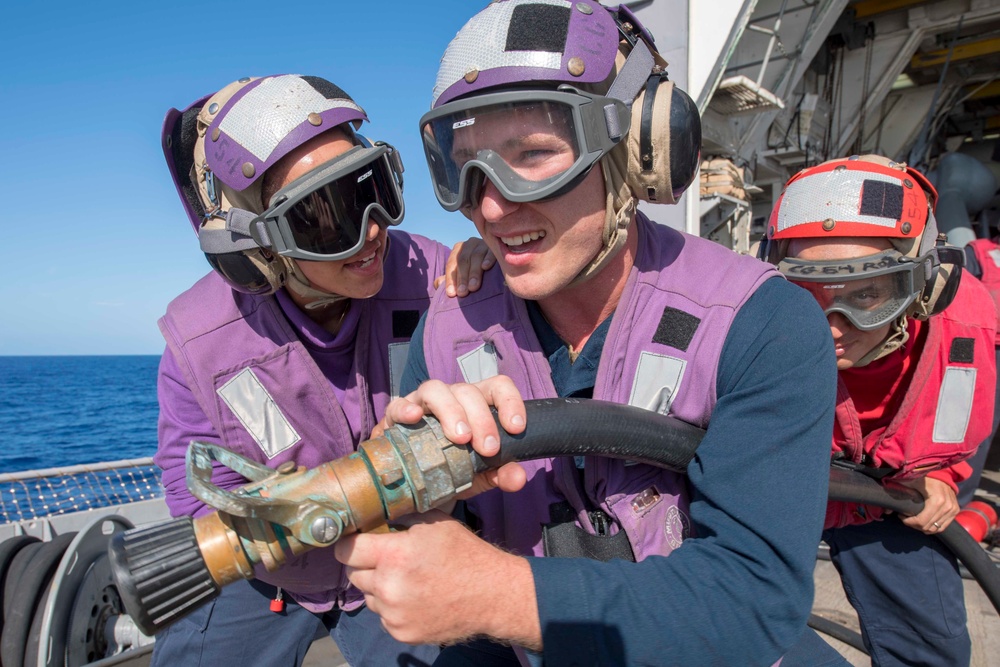 USS Antietam (CG 54) Sailors engage in a crash and salvage training drill