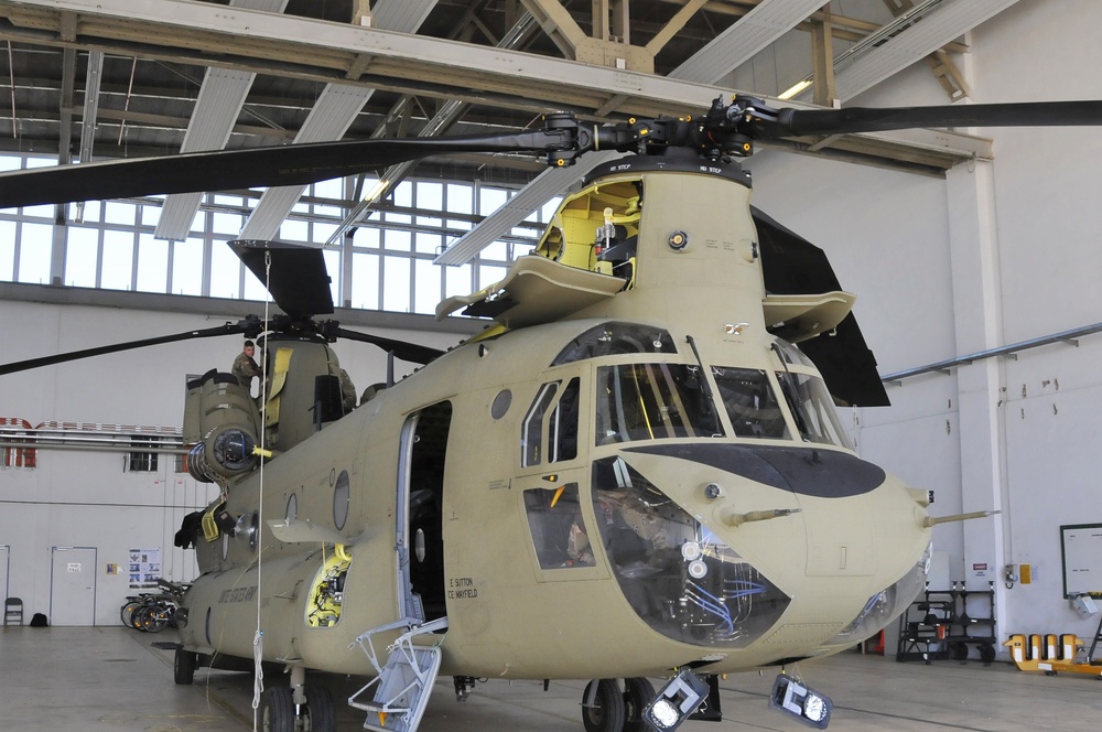 Soldiers conduct 200 hours phase maintenance on an CH-47 Chinook helicopter.