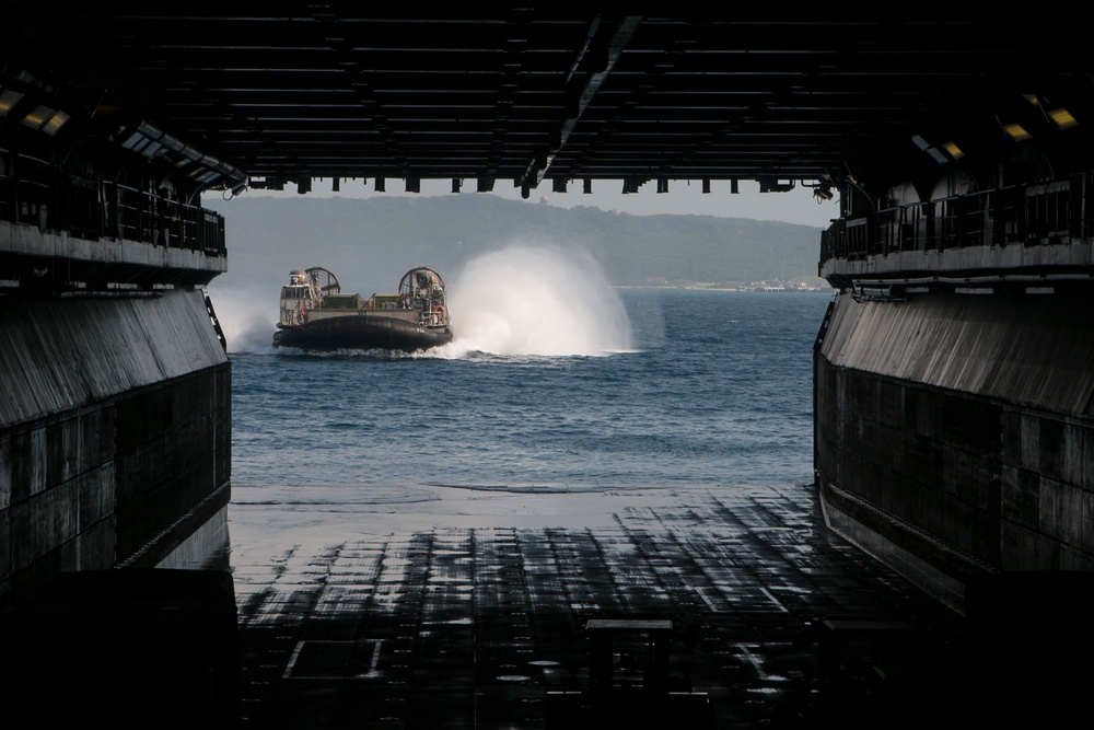 CLB-31 Marines use LCAC to load gear
