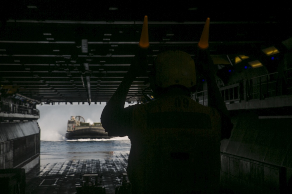 CLB-31 Marines use LCAC to load gear