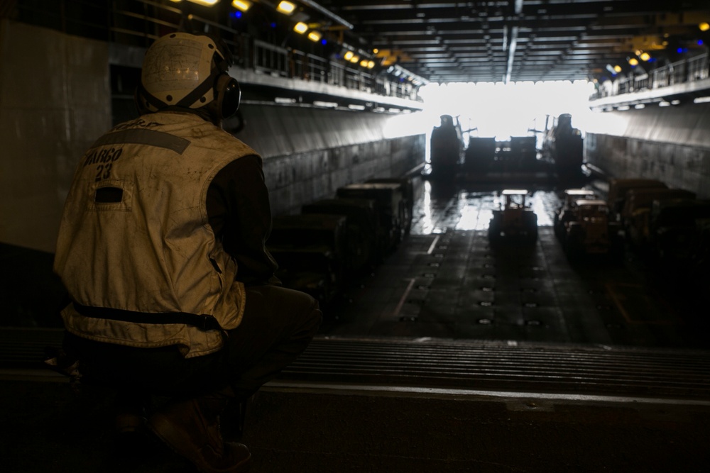 CLB-31 Marines use LCAC to load gear