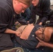 Hospital Corpsman 2nd Class Devina Gutual (right), from Salinas, CA, receives medical attention as a simulated casualty during a general quarters training exercise on the Ticonderoga-class guided-missile cruiser USS Antietam (CG 54)