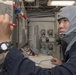 Ensign Francis Lee, from Garden Grove, CA, engages in a general quarters training exercise on the Ticonderoga-class guided-missile cruiser USS Antietam (CG 54)