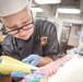 Culinary Specialists Decorate Cake Aboard GHWB