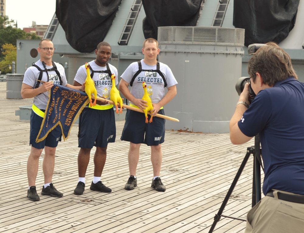USS Carter Hall (LSD-50) CPO Selectees pose with their guidon and rubber chickens aboard the USS Wisconsin (BB-64)