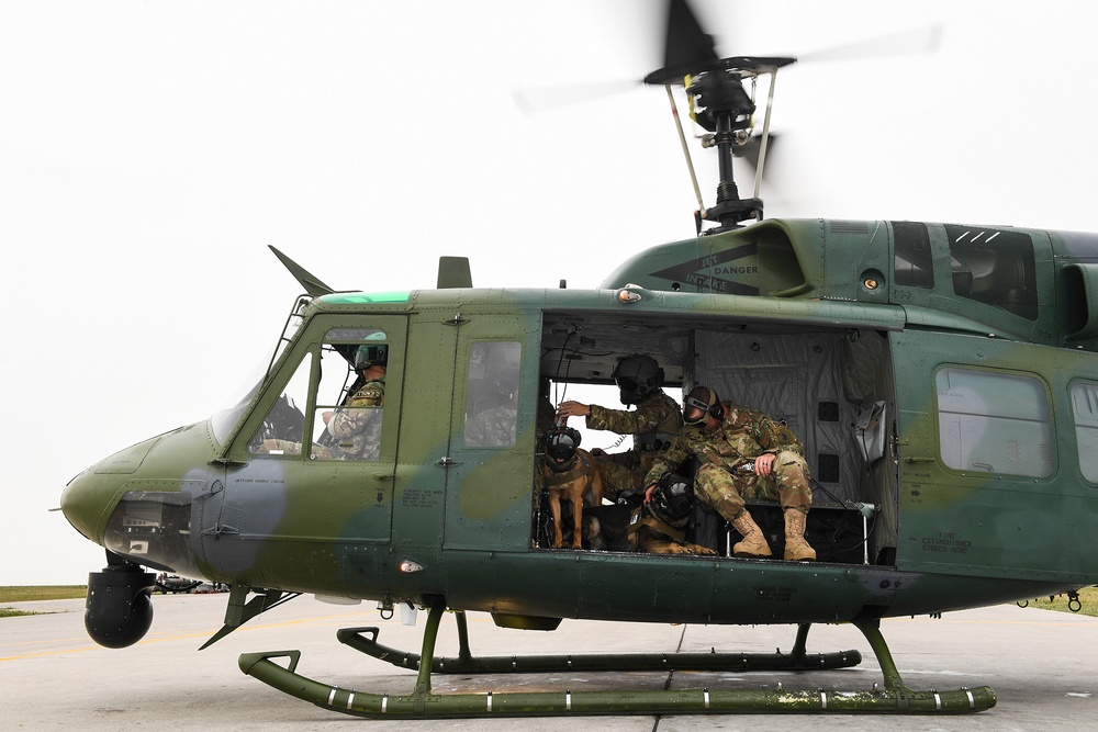 5th SFS MWDs fly with 54th Helicopter Squadron