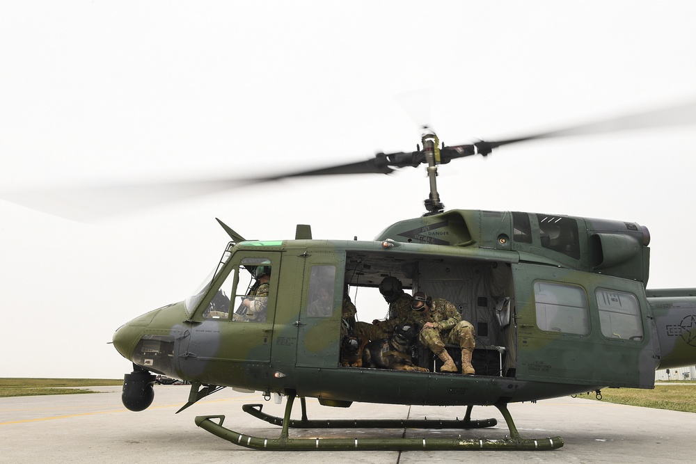 5th SFS MWDs fly with 54th Helicopter Squadron