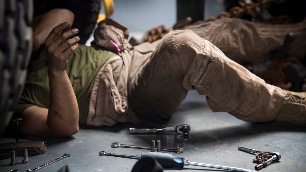 Motor Transport Mechanics repair worn parts on a Humvee