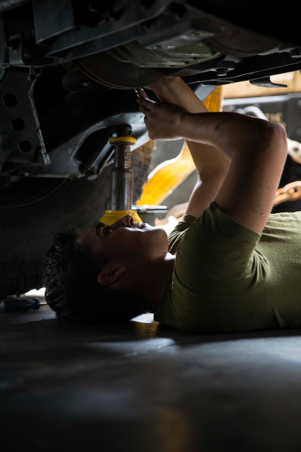 Motor Transport Mechanics repair worn parts on a Humvee