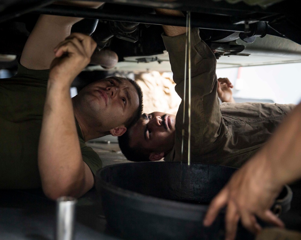 Motor Transport Mechanics repair worn parts on a Humvee