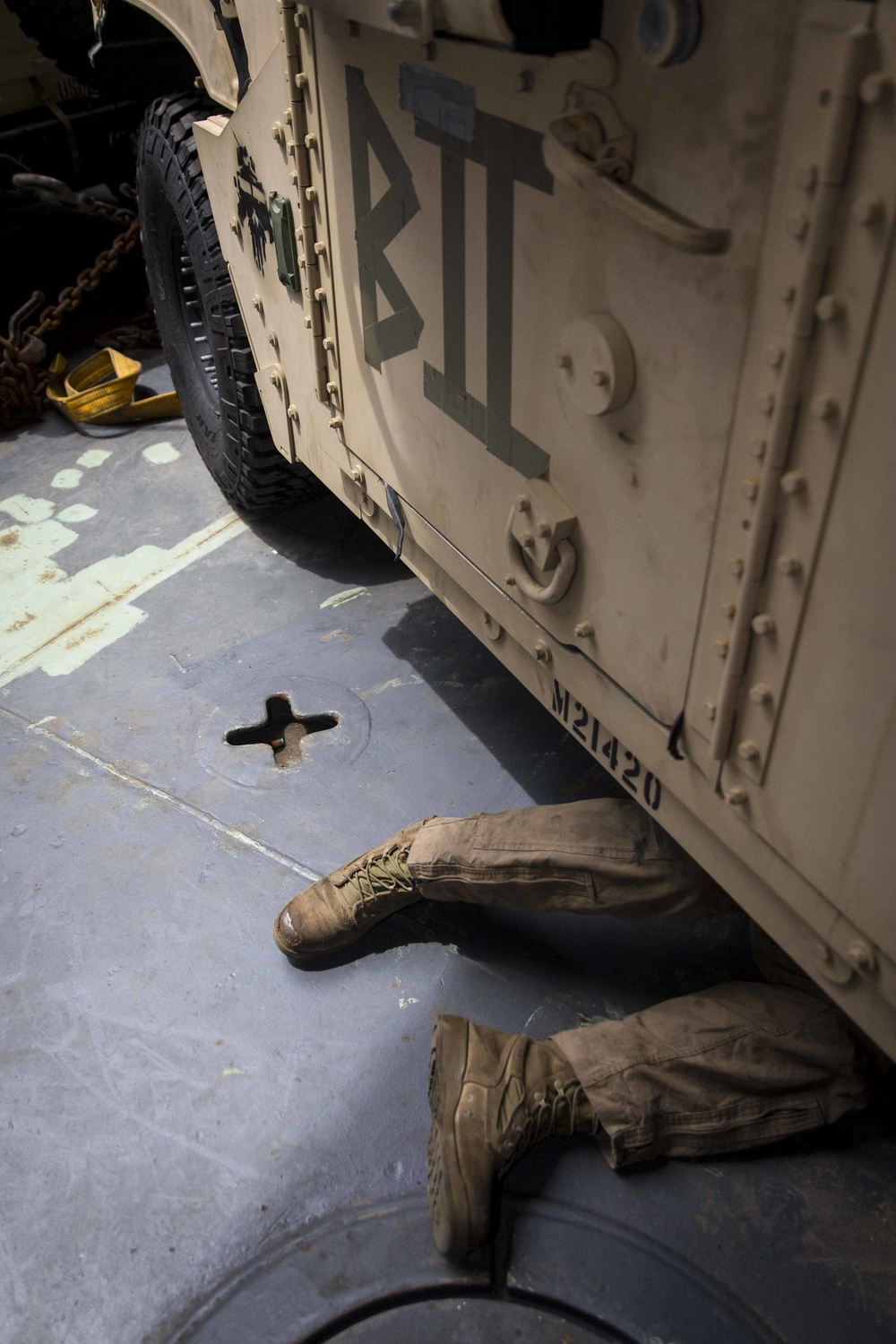 Motor Transport Mechanics repair worn parts on a Humvee