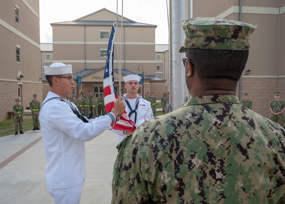 NMTSC Sailors Hoist Flag to Half-Staff