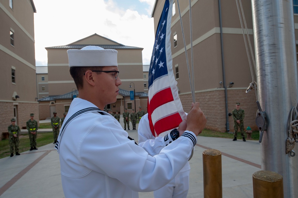 NMTSC Sailors Hoist Flag to Half-Staff