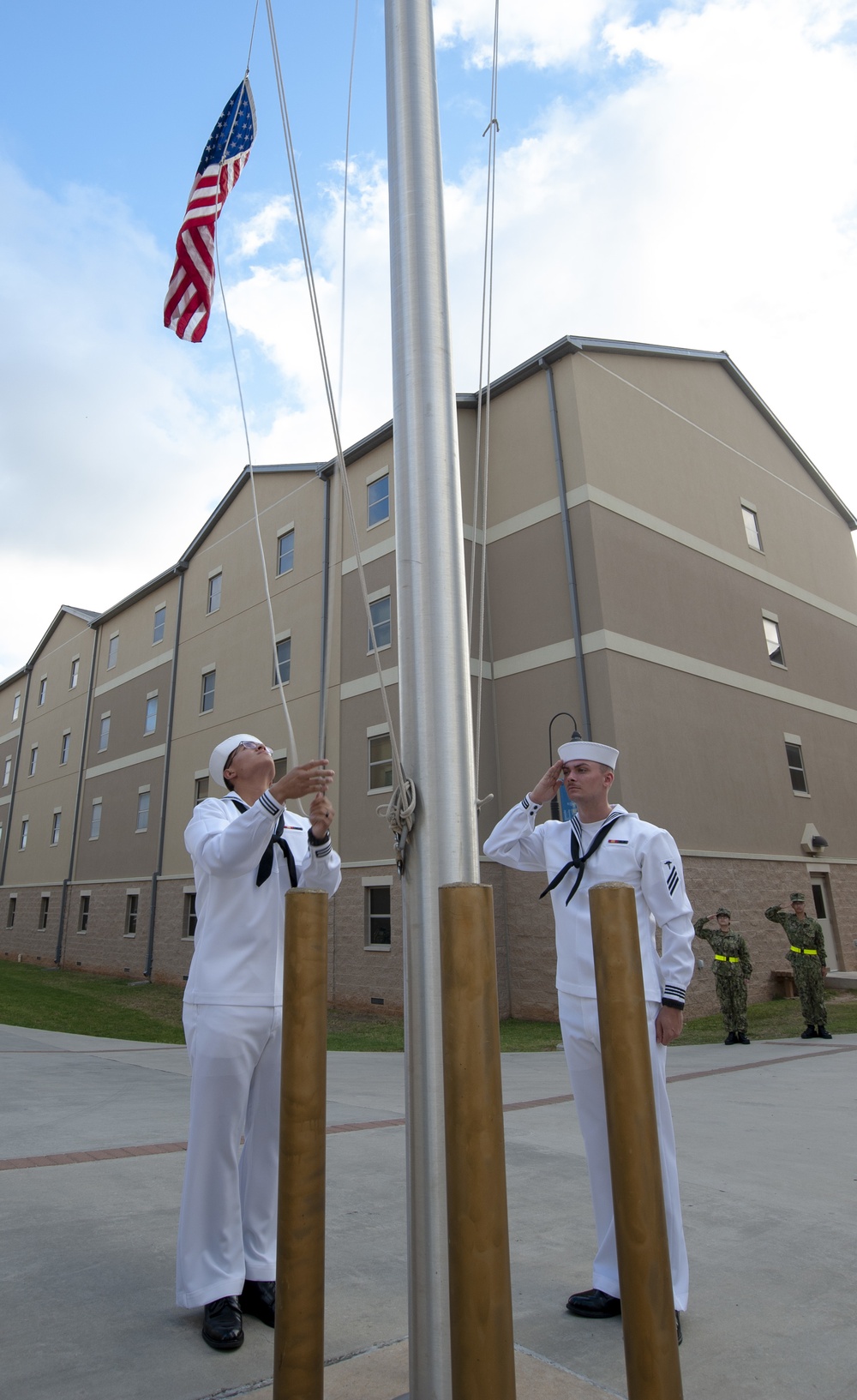 NMTSC Sailors Hoist Flag to Half-Staff