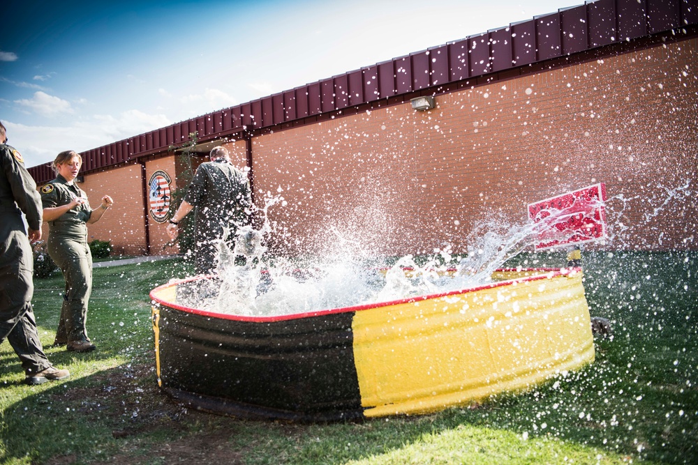 Solo pilot receives dunk tank tradition