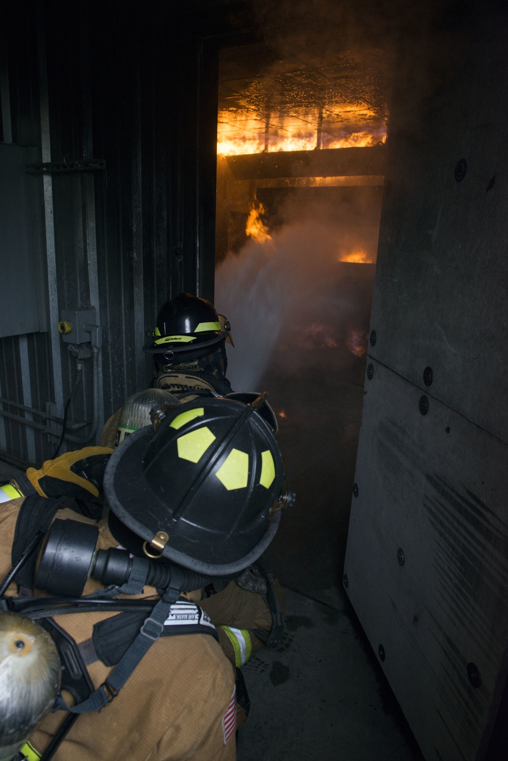 Air Force firefighters conduct wartime-firefighting readiness training at JBER