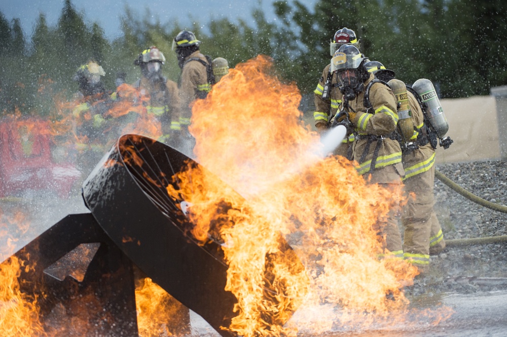 Air Force firefighters conduct wartime-firefighting readiness training at JBER Air Force firefighters conduct wartime-firefighting readiness training at JBER
