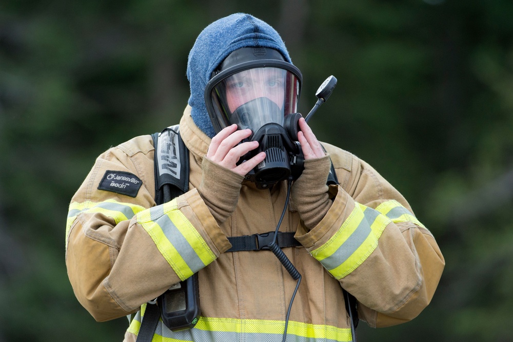Air Force firefighters conduct wartime-firefighting readiness training at JBER Air Force firefighters conduct wartime-firefighting readiness training at JBER